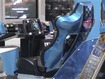 AOU 2003 Amusement Expo: That seat looks comfy; better be for 1200 mph cars