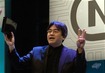 Iwata holding the Revolution prototype